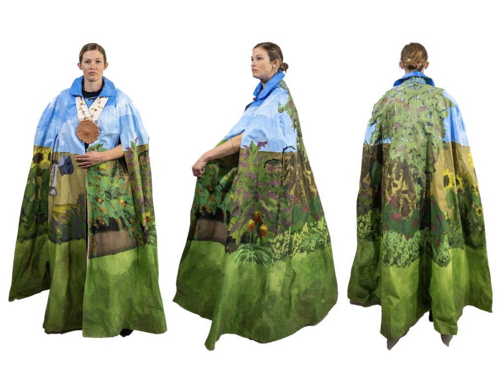 Inspired by my garden and painted with a panorama of summer’s peak. Features include two holes for your arms/hands and a hand-made, painted terracotta goose head pin to keep the keep secure at your neckline.