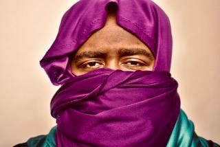 This is one picture from a collection of pictures I took. The title of the collection is called 'Colorful Black Men'. This collection shows a variety of black men with colorful flowers, expressing themselves freely. Some of the pictures are in black and white showing the more subtle solemn side of these beautiful black men. This picture is called 'Eyes Express', the model's name is Mike Jon.