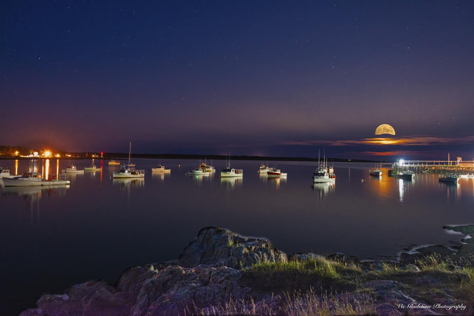 Digital image of full moon rising over Prospect Harbor, ME