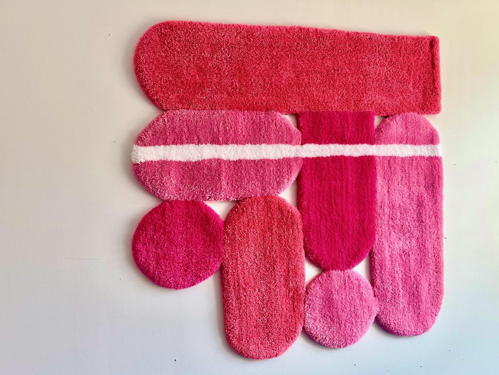 Hand tufted wall rug made from 100% acrylic yarn and primary backing fabric.