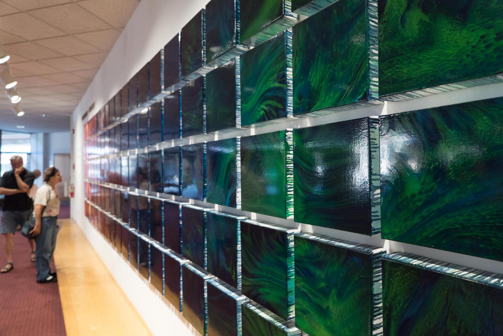 A color story told across a grid of 100 paintings. The imagery interprets the journey of a CME (coronal mass ejection) through space to Earth where it results in the appearance of the auroras.