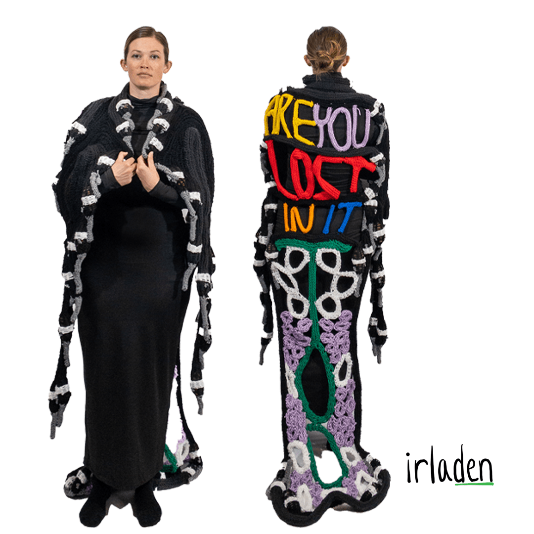 This hand-knit cape features dozens of knitted goose heads and typographical letterforms on the back that say, “Are you lost in it, too?” Inspired by the trials and tribulations of parenting during the year 2020 (remember that year?), this cape will keep you warm and safe. “Are you lost in it, too?” is a lyric in a fantastic song called Headlock by Snail Mail–check it out.