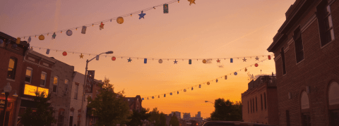City street at sunset with hanging lanterns