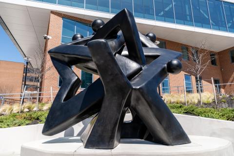 Close up view of Community of Stars sculpture at Coppin State University