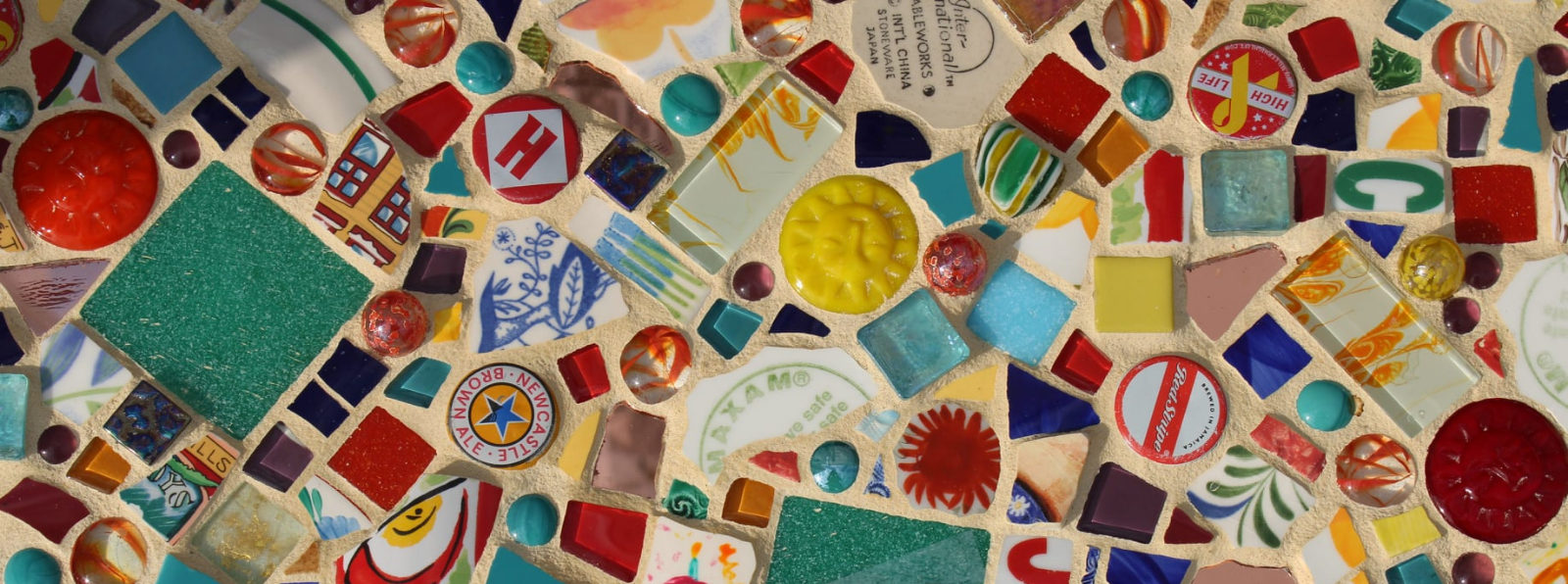 A mosaic featuring different objects and materials.
