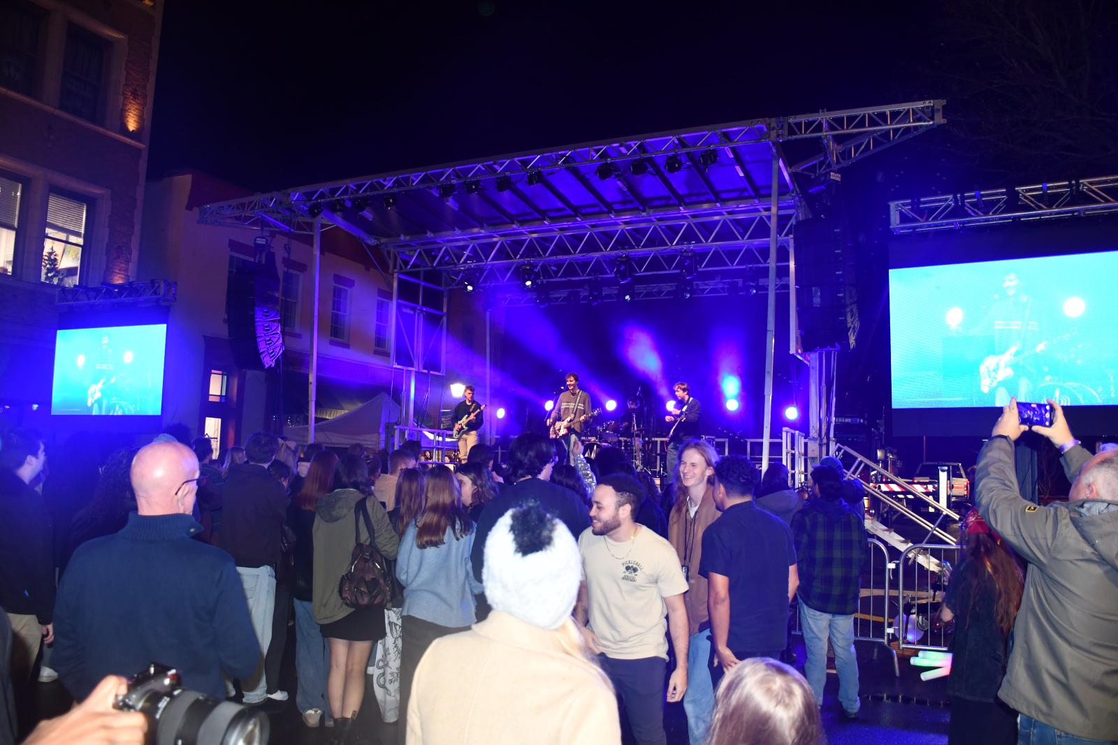 Salisbury Arts and Entertainment header image. Band performing a stage to dancing audience.