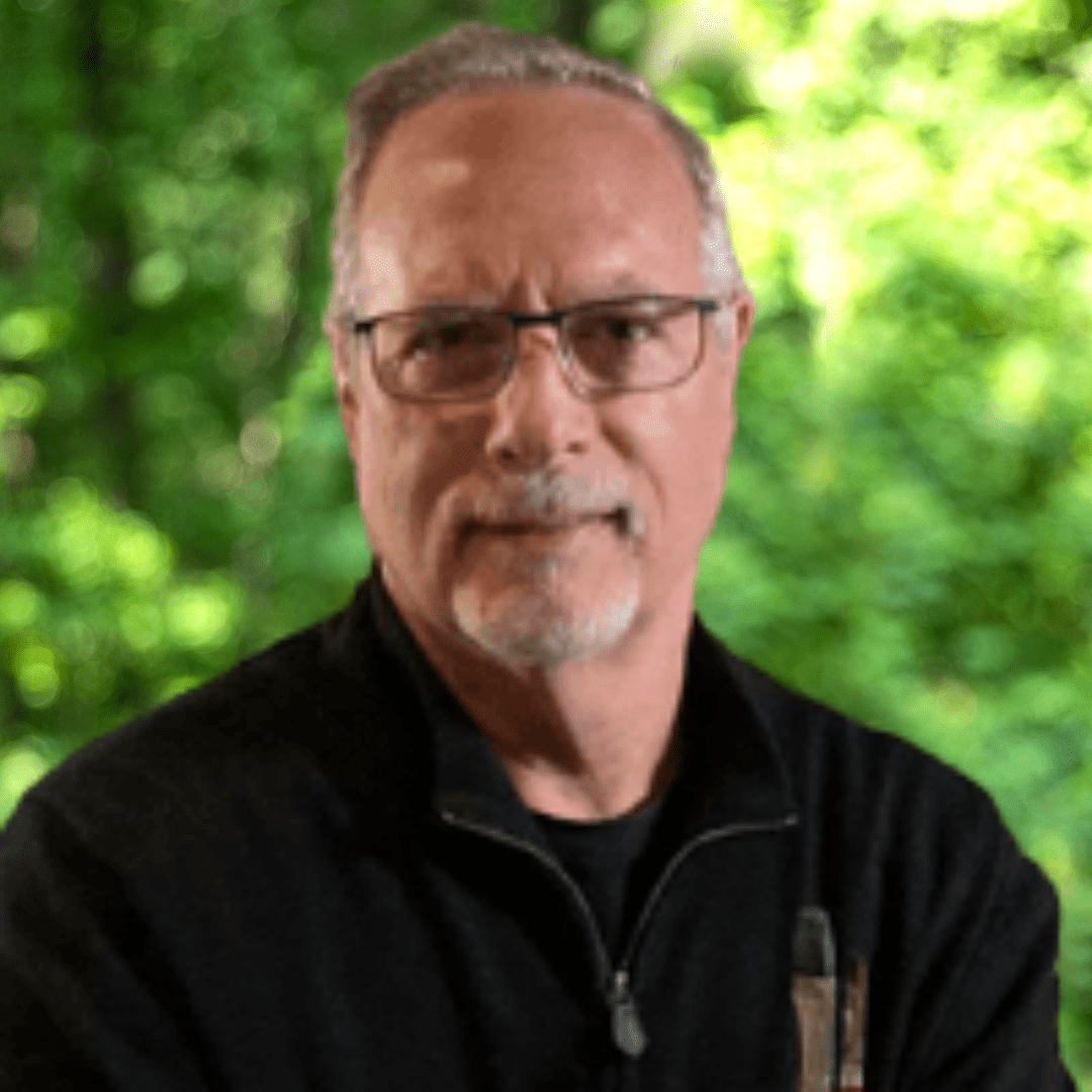 Christopher Sloan Headshot. Man wearing glasses and dark shirt