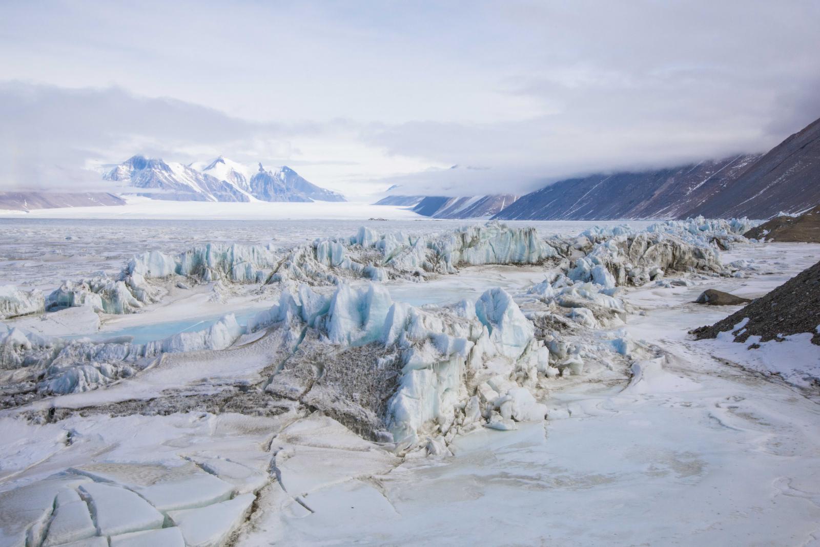 The Baroque-looking sea ice pressure ridges below the Double Curtain Glacier are seldom visited, as they are only accessible by an hour-long trip via snowmobile from the small New Harbor field camp.