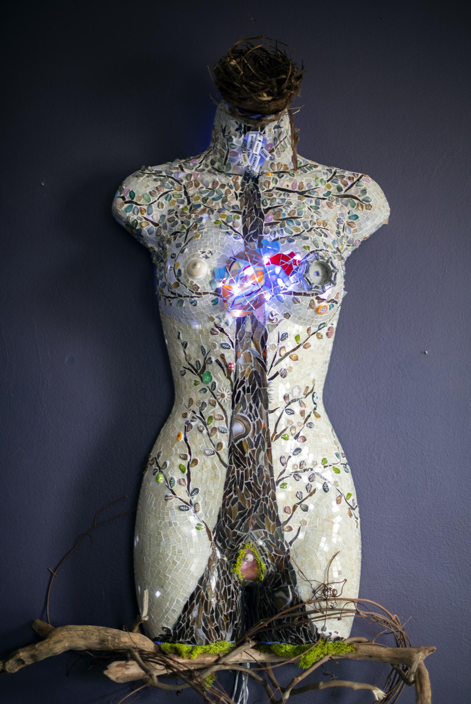 "Mother" is a tribute to a woman's body when she is a mother—how she is rooted, how her branches reach, how her nest is always open, and how her heart is offered.