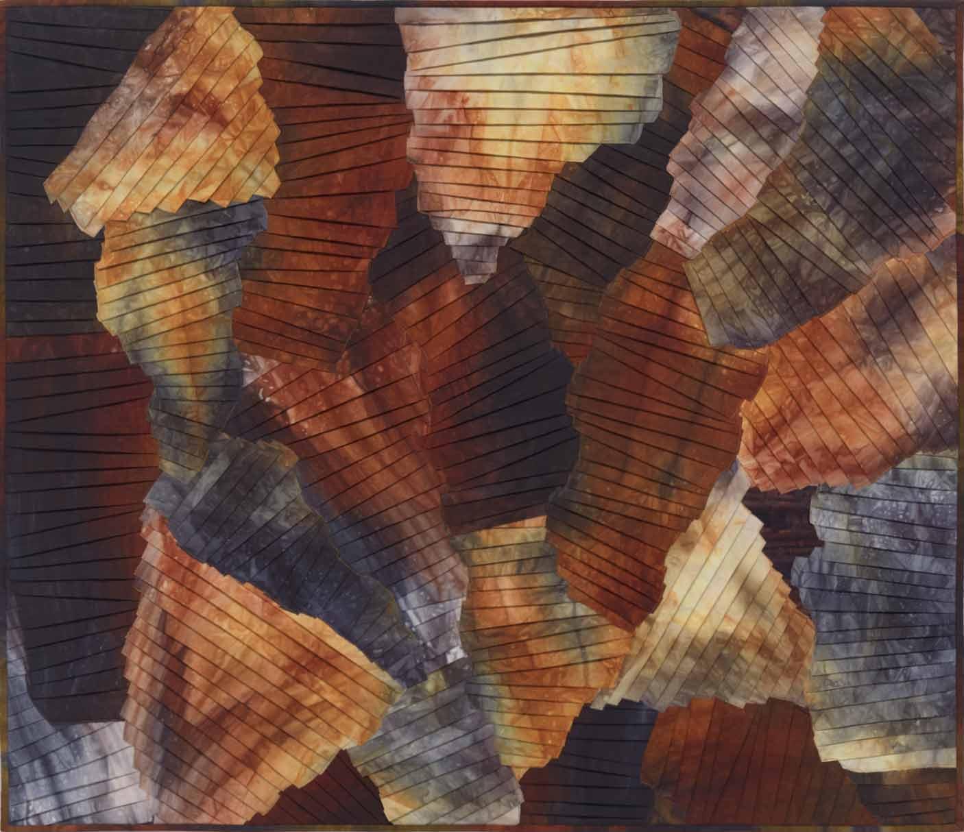Fiber art collage of pleated strips of hand dyed fabrics suggesting a Canyon.