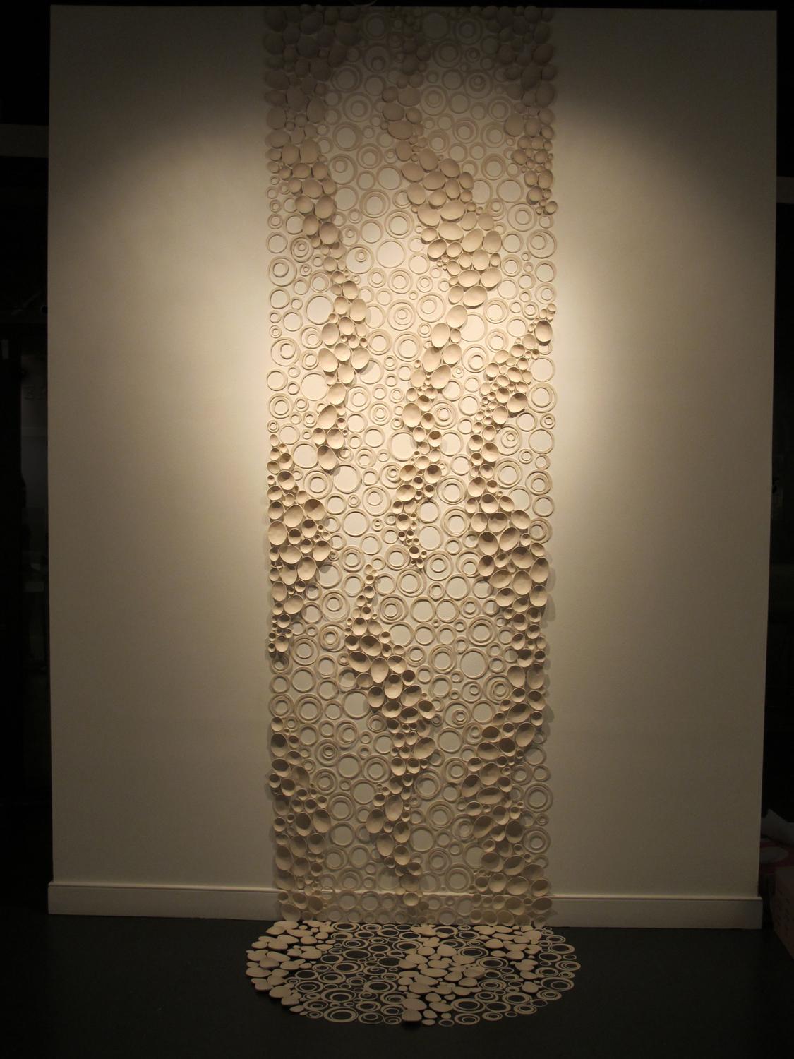 Path of Water wall installation of individual porcelain pieces. 2012 gallery installation view.