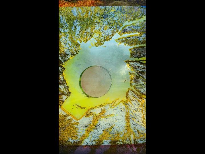 free standing art glass wall in exterior park setting,