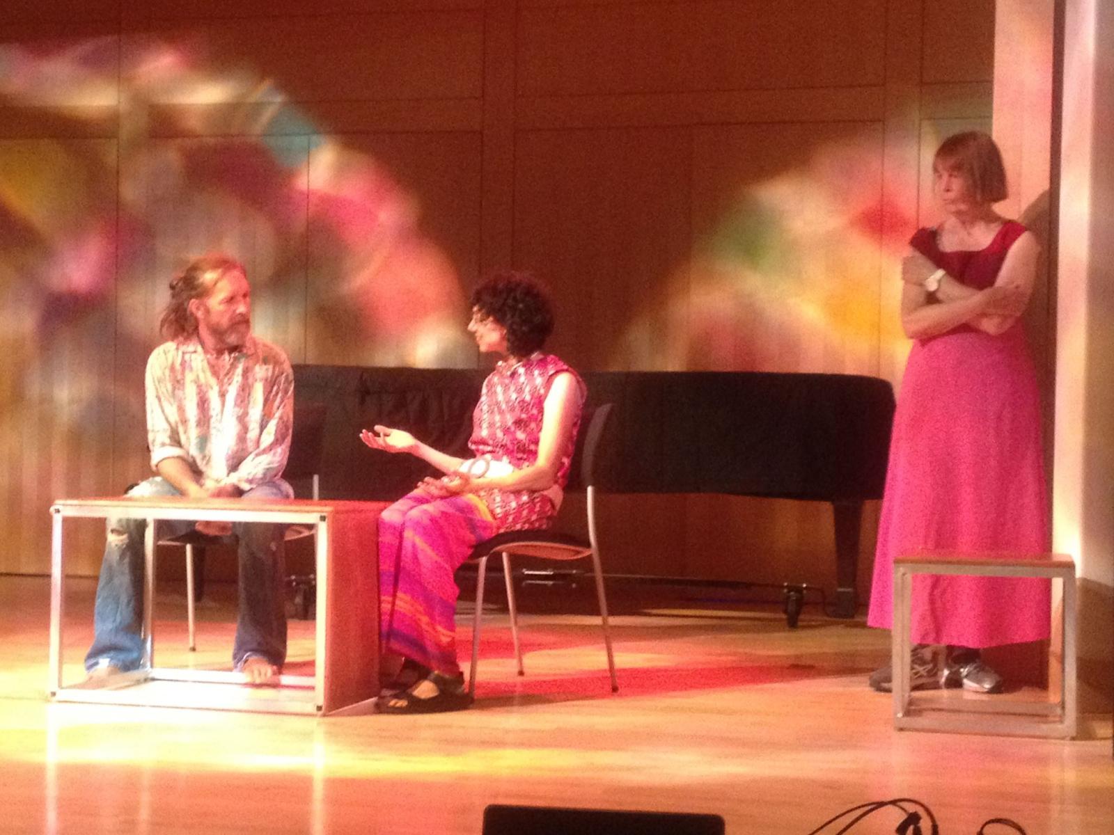 Written and directed by Theresa Columbus
Sound recording by Aaron Smith
Cast
Linda Campbell Franklin
Theresa Columbus
Aaron Smith
Jake Budenz (dancing)
“Love Trilogy,” performed at Worlds in Collusion as part of Artscape in 2015, is a collection of 3 short plays written within a year’s time, navigating the sheer joys and the huge doubts and frustrations that can accompany romantic relationships. In the first play, “I Will Dance for You,” rejoicing in Joni Mitchell’s racier lyrics and bursting with giddy optimism, the artist (Columbus) and her lover (Aaron Smith) act out her thoughts about the relationship. She puts her words in his mouth, but at the same time often quotes him, putting his words in her work as well as in her mouth. The two act out their own prerecorded voices, and play with the trope of musical theater.
The second play in the trilogy, is entitled “New Years Day 2015,” and chronicles one of the saddest and most yearning days of their 5 year relationship. Throwing away a little piece of nature from her hometown he had given her on a walk links her to the act of destroying precious things dating back to her earliest memories. This scene takes place between her and a good friend (her writing? her conscience? …or maybe a good friend.)
The third play in the trilogy, “The Second Dawn of the Year,” speaks to the poetry that follows these most intense relationship days, the artist reaching for words to help express what seems like volumes of conflicting emotions. Technology is a metaphor for emotional difficulties, cardinals and shadows metaphors for poetry and what works. Smith sings a song that he wrote in the first year of their love, and again she puts her words into his mouth as well as the mouth of her friend/conscience to explore the way words inspire and resonate and adhere to people as they become part of each others’ lives.
