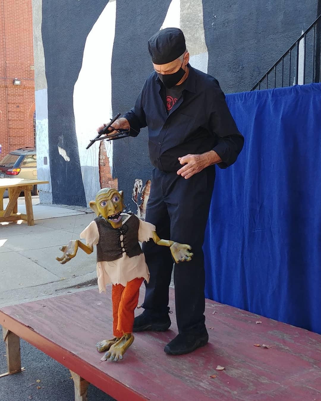 Michael Lamason of Black Cherry Puppet Theater performing a one person variety act for Puppets in the Park(ing) Lot.
Photo by Schroeder Cherry