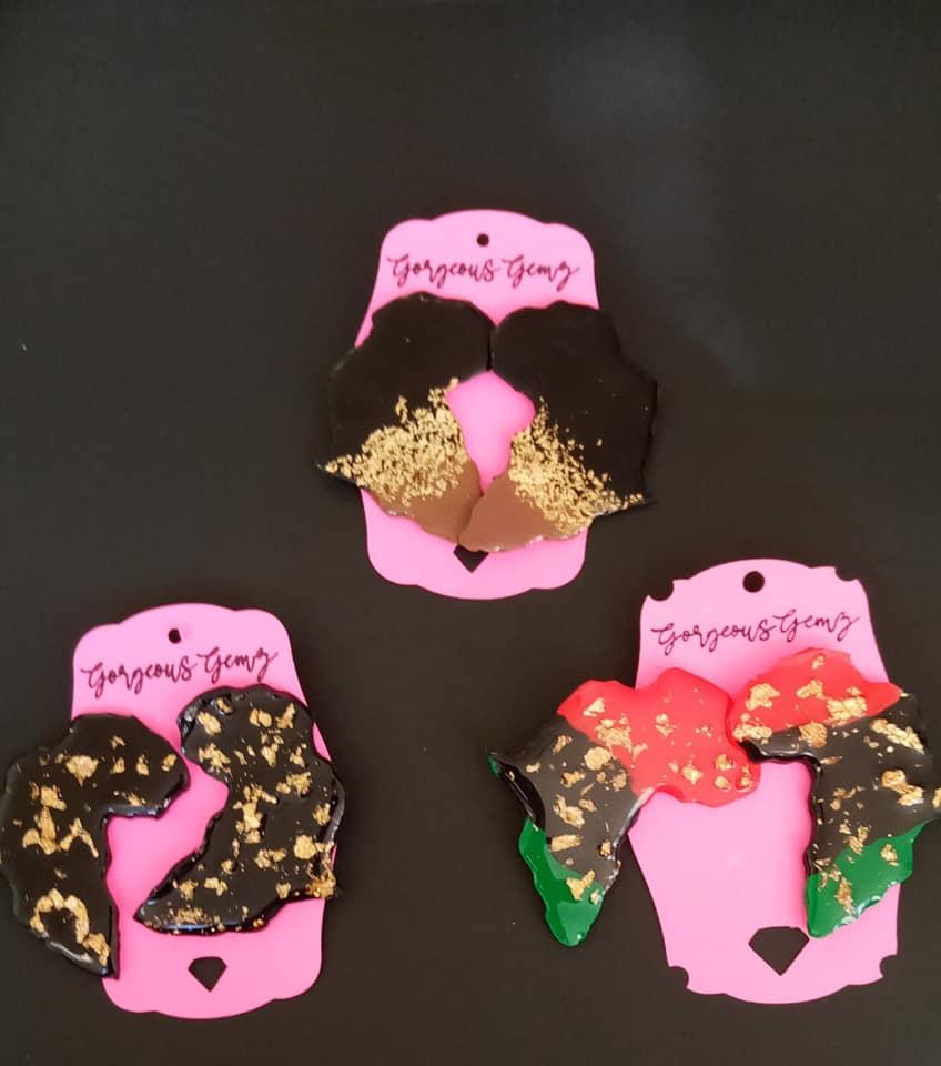 Handmade polymer clay earrings, cut and shaped to resemble, Africa.