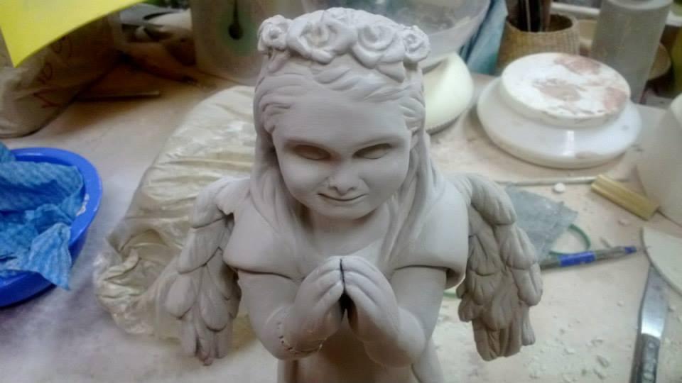 This was a commissioned piece to sculpt an angel with their daughter's face.