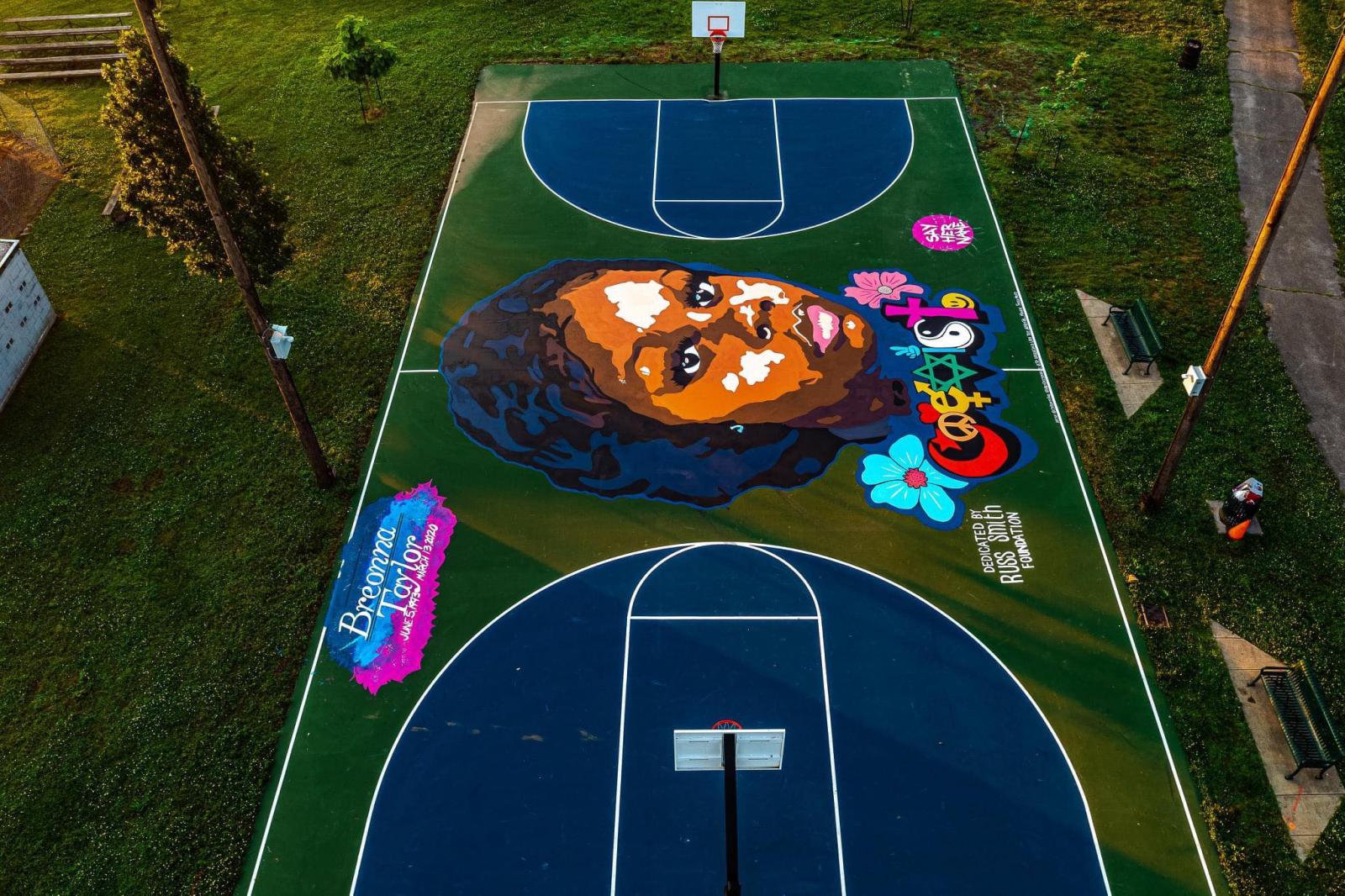 Basketball court mural painted in Lousiville, KY at Lannan Memorial Park