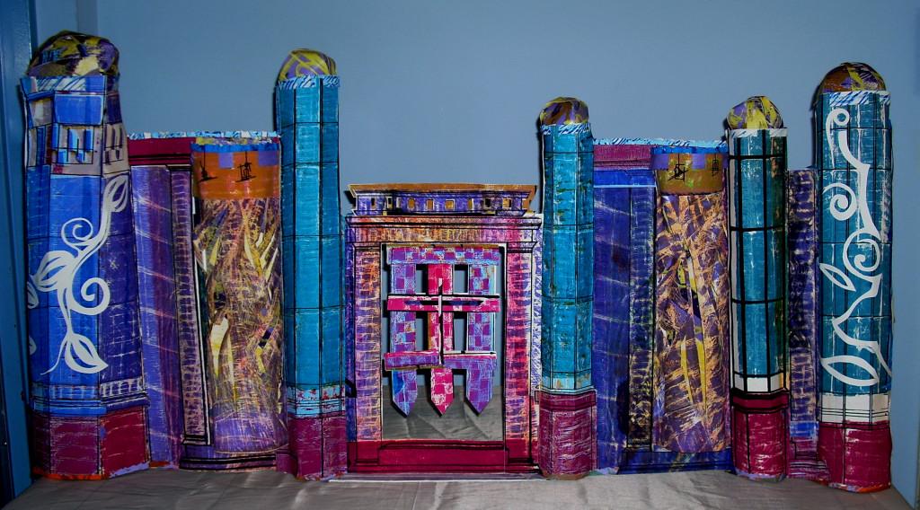 This piece serves as my introduction to “The REAL Estate” series and my interpretation of the heavenly kingdom. Included in this free-standing three dimensional double-sided stone image structured castles are metal and wood design gates, stain glass windows. Another interest for creating this piece represents the spiritual influence in my life and artwork. With these series, the viewer will recognize the importance and impact of spirituality in visual communication.