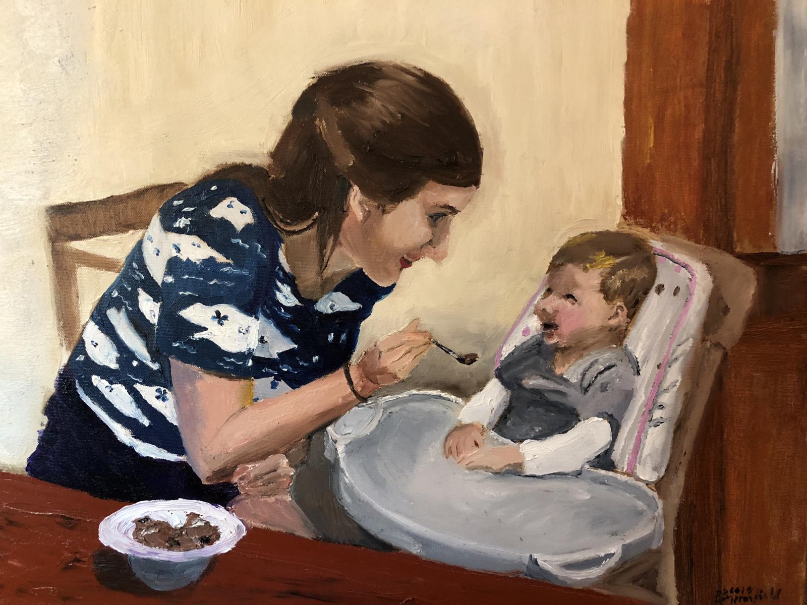 A young mother is giving her baby a spoonful of ice cream.  Obviously not the first because he is delighted.