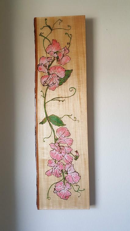 The sweet pea is a flowering plant in the genus Lathyrus in the family Fabaceae, native to Sicily, Cyprus, southern Italy and the Aegean Islands. It is an annual climbing plant, growing to a height of 1–2 metres, where suitable support is available. In this Piece I tried to highlight the climbing movement of the flower. Sweet peas have 110 species and belong to the pea-flower subfamily of the Fabaceae family. Plus it smells heavenly. Too bad I couldnt make it a scratch and sniff picture! Detailed colored wood burning painted with acrylic paint. Finished with an epoxy resin to prevent dulling color, chipping, or fading.
