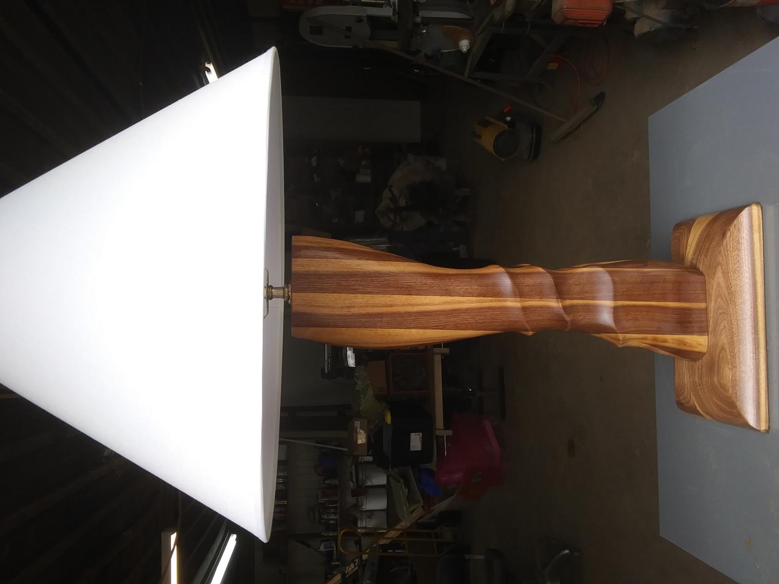 Table lamp sculpted from walnut.