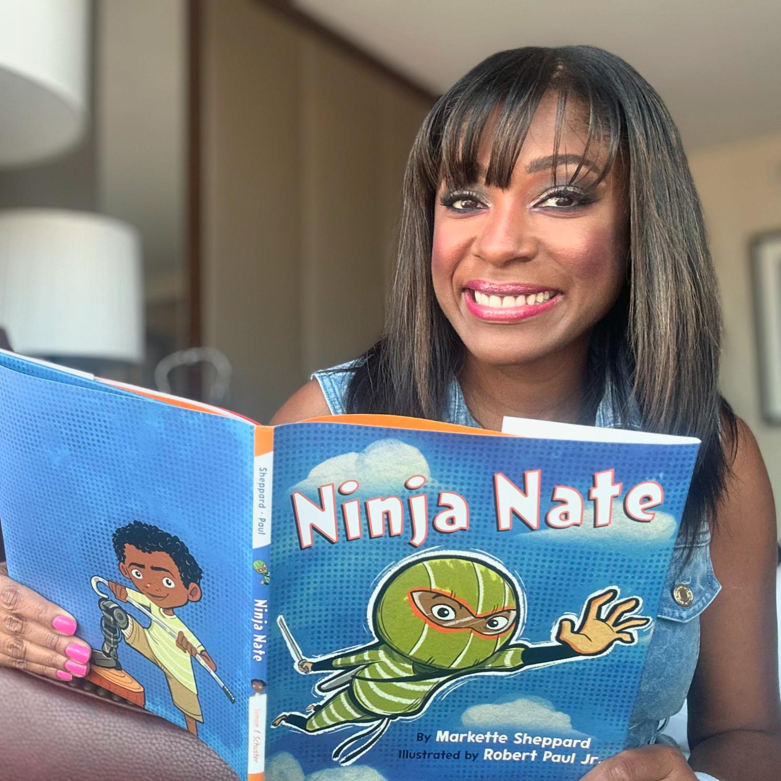 A photo of the author, Markette Sheppard, with her book, "Ninja Nate."
