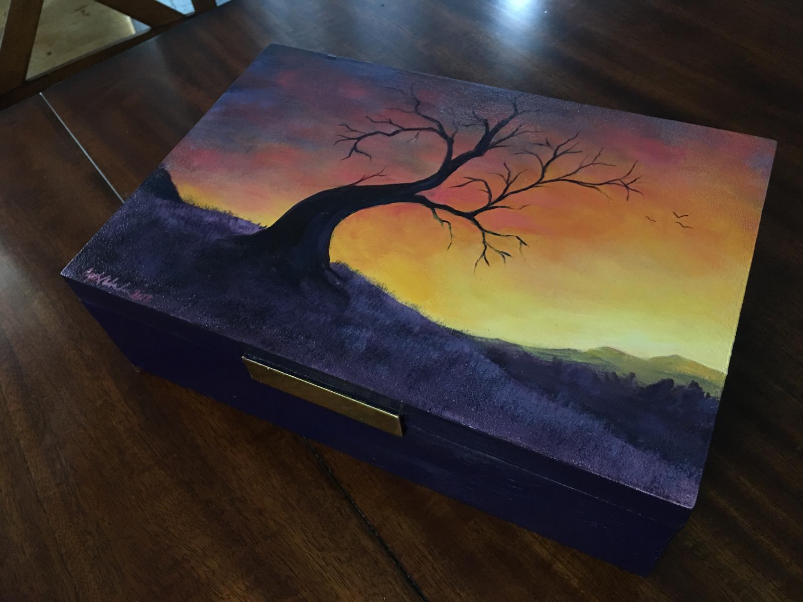 This is a large, hand-painted storage box, featuring original artwork by Crystal Wonder. 