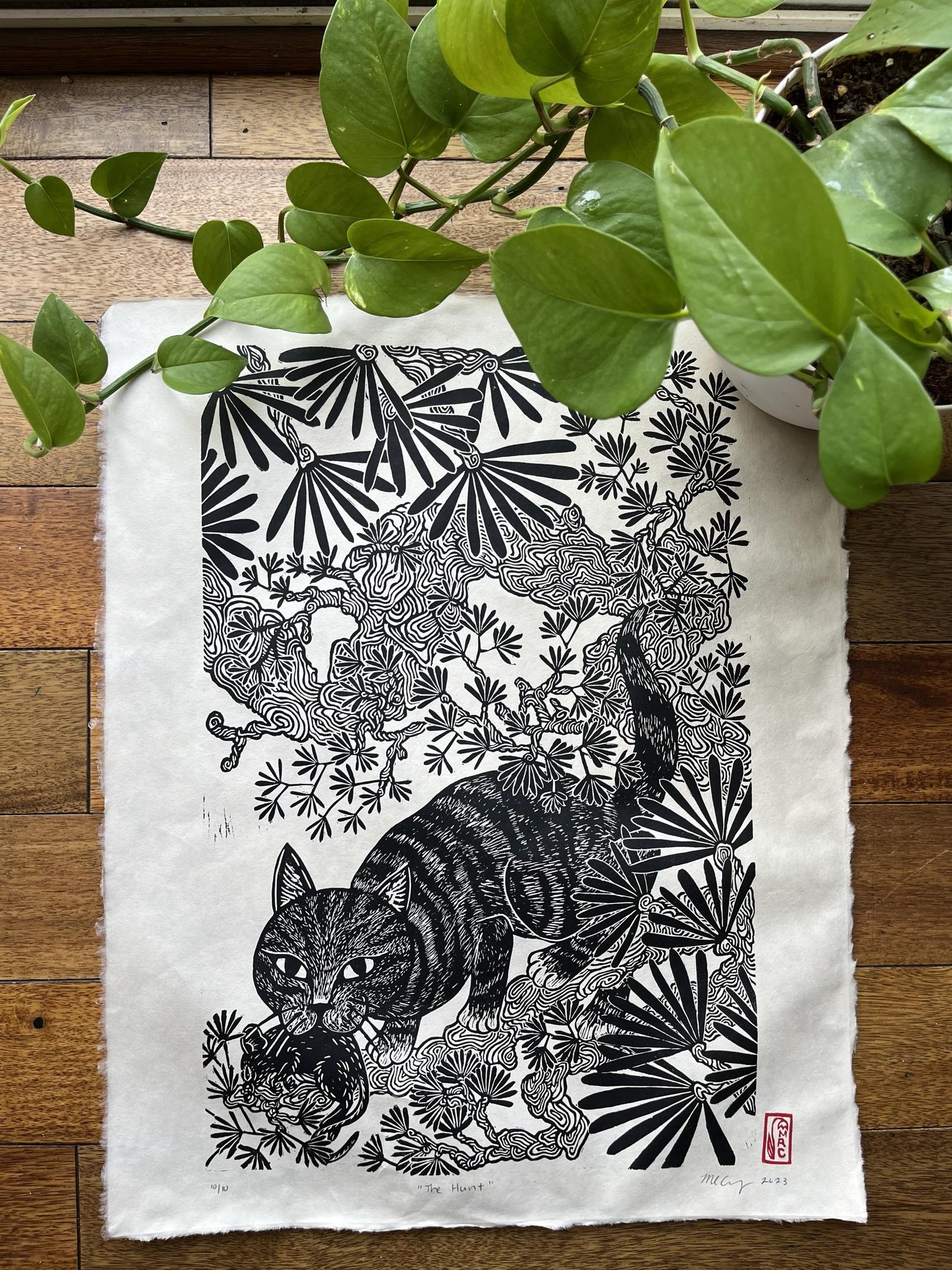 The Hunit is a hand-carved linoleum block print printed ink black ink on 16x20” natural kitikata paper. The Hunt is print number one in a series dedicated to animal wildlife in ode of traditional Japanese woodblock prints. In the sprawling black pine tree, we see a dedicated feline catch her prey.