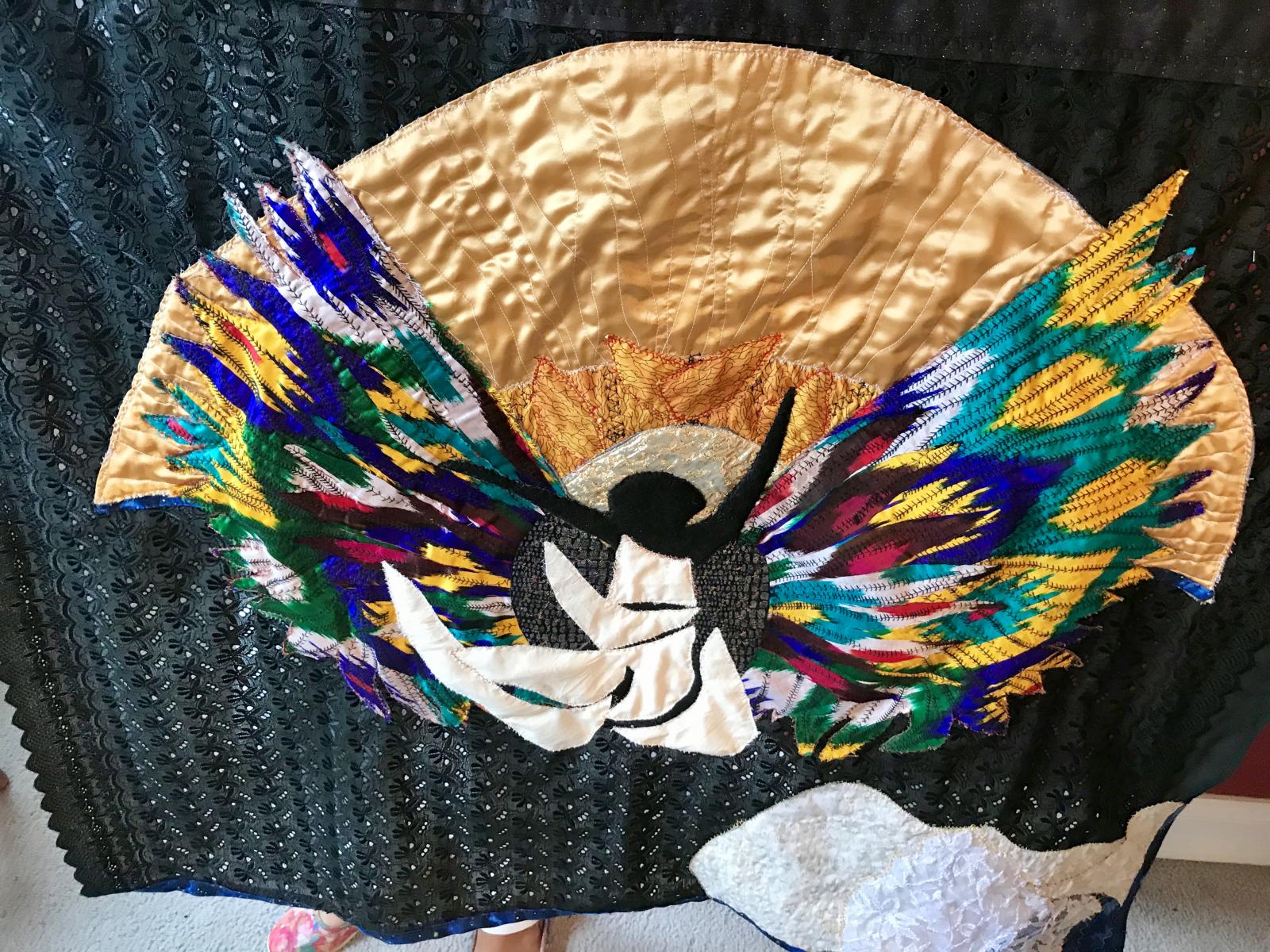 Silk Ikat raw edge applique on black eyelet lace, metallic threads, free motion quilting. #3 in a series - Las Angelitas Negros