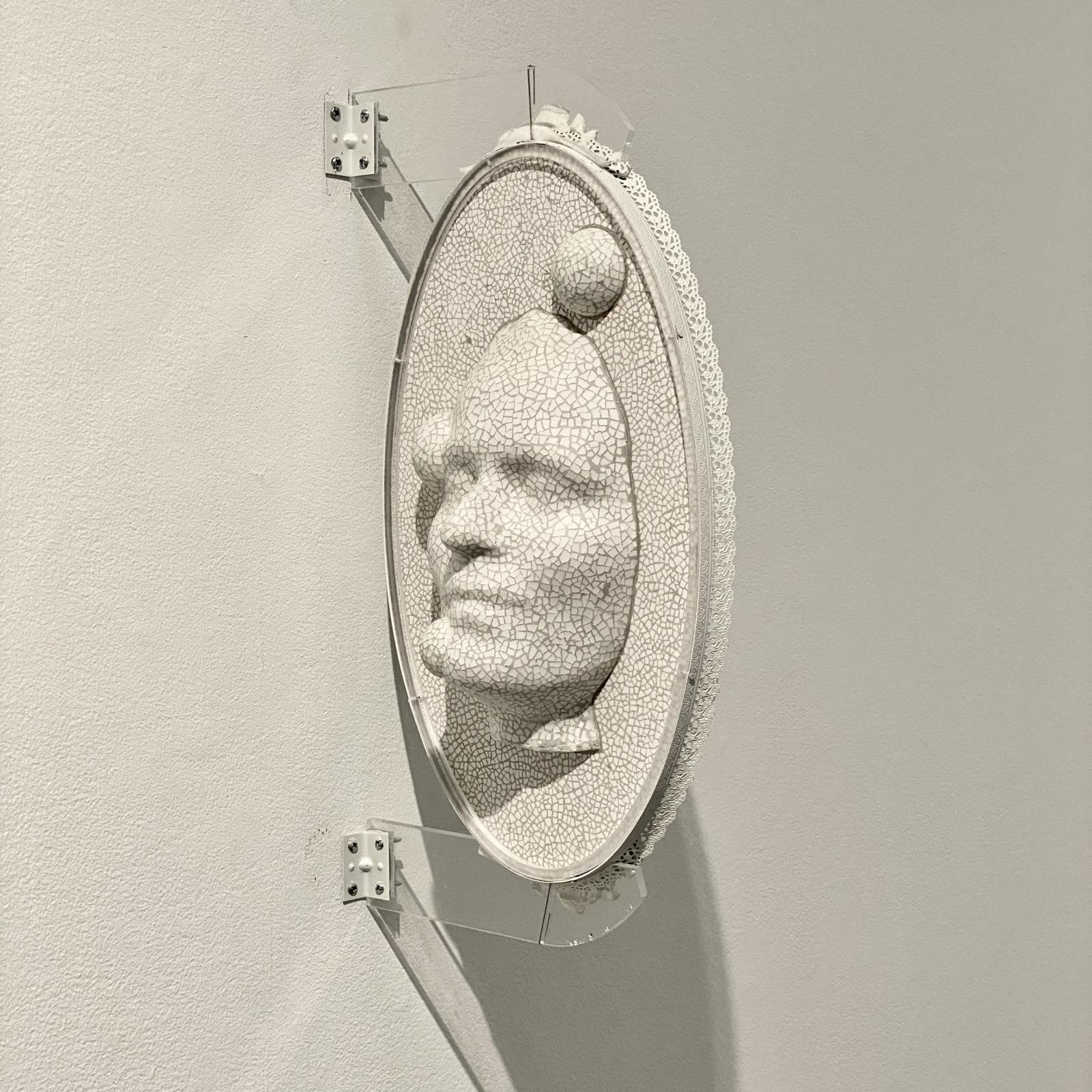 Self portrait in cameo format. Life sized from face scan, spheres from Chinese meditation balls. On antique mirror. Wall mounted with both sides visible. 