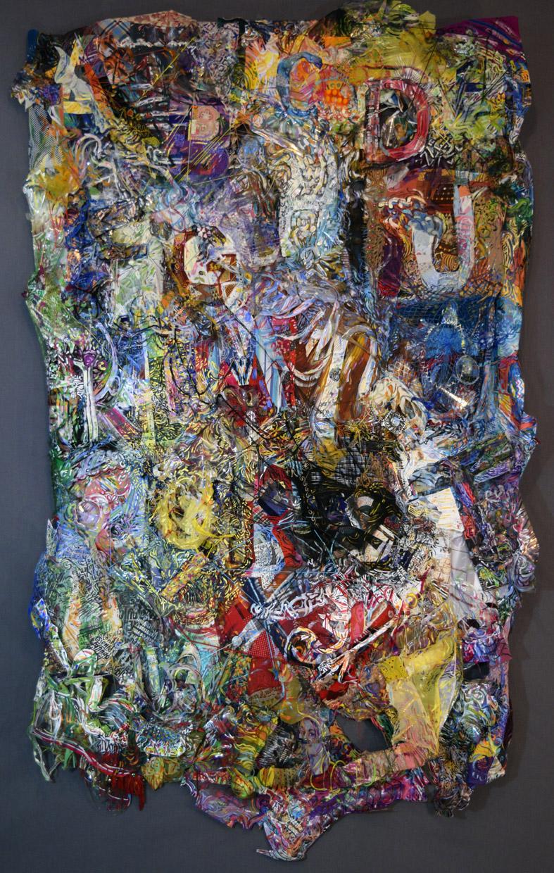 Wall relief made of quilted patchwork, beading, embroidery, found objects, plastic, collage and paint.