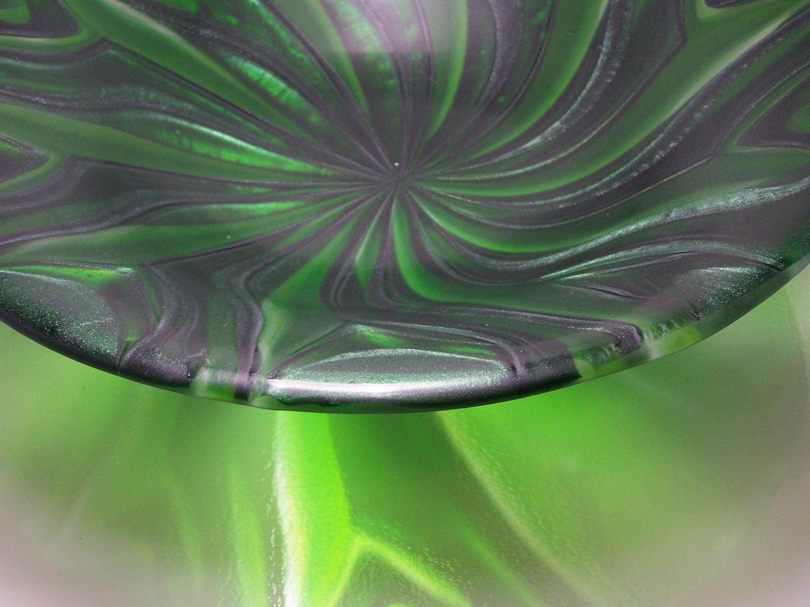 Fused glass bowl using the flow technique.  This bowl was mad with clear, transparent green and aventurine green glass. 