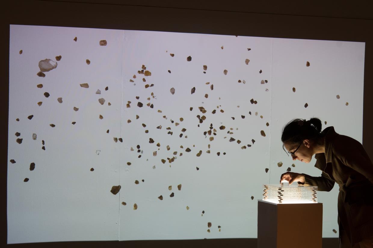 Video installation and sculpture using location mapping from Open Baltimore Police Department Part 1 Victim Based Crime Data. A 6 minute looping animation projected in 4K on the wall paired with a pedestal light sculpture of layers of sand mapped to homicide data in Baltimore from 2007-2017.