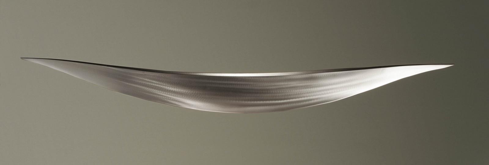 Plain and simple, this silver steel boat sculpture has a truly quiet elegance.