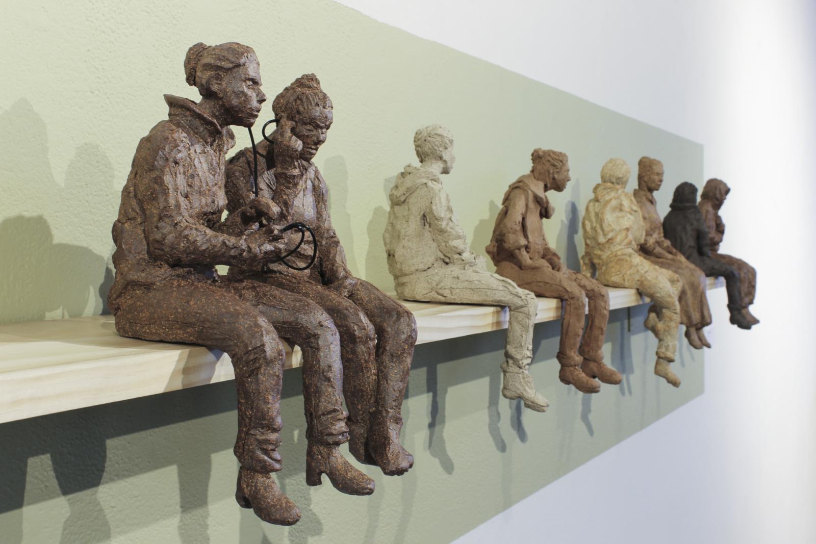 Ceramic wall installation during Weaving Visions, the annual resident show at Creative Alliance. Bus Stop includes 12 8-10" ceramic figures.