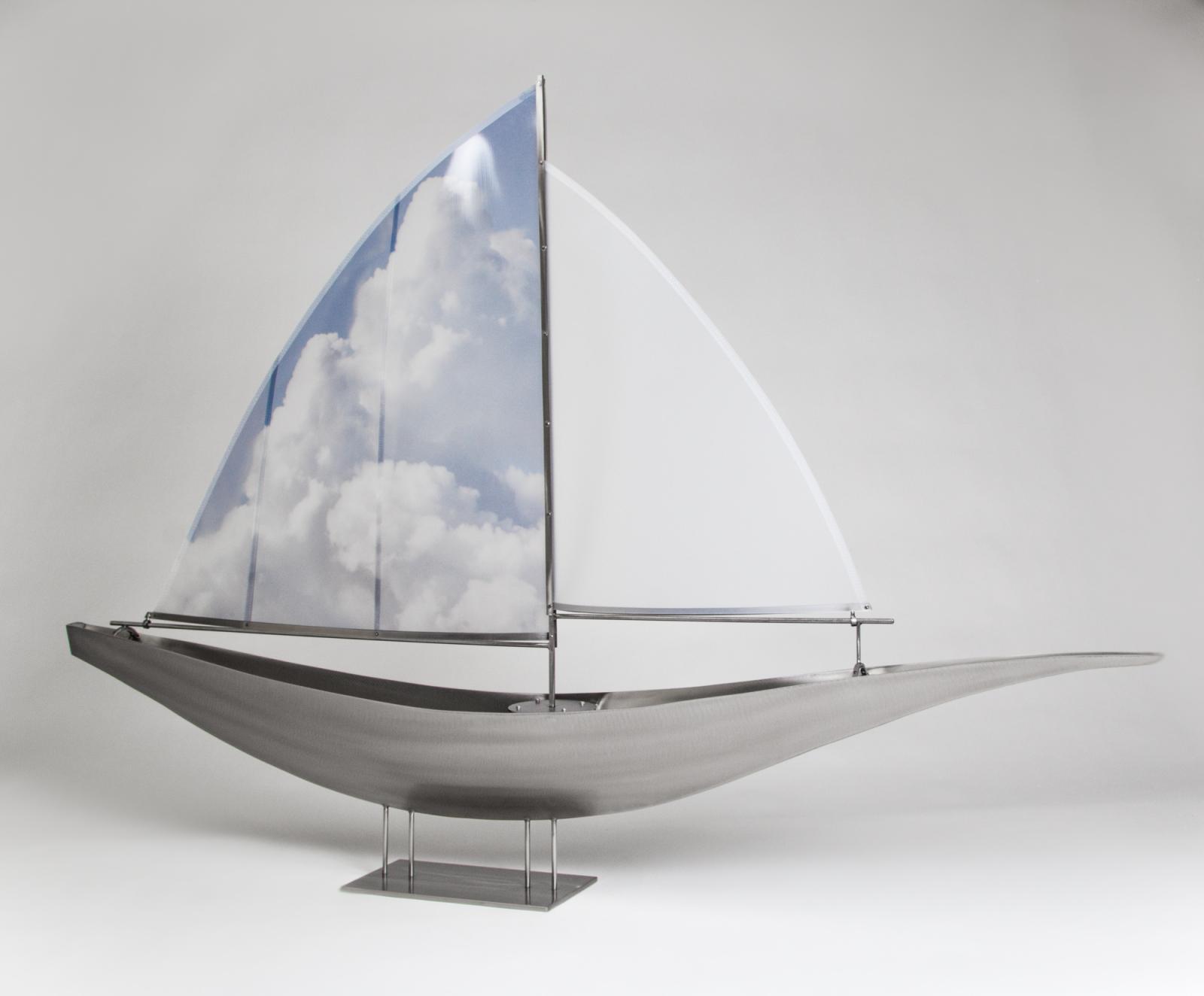 Inspired by the port of Baltimore, this ship with clouds on the sail represents the freedom of being at sea.