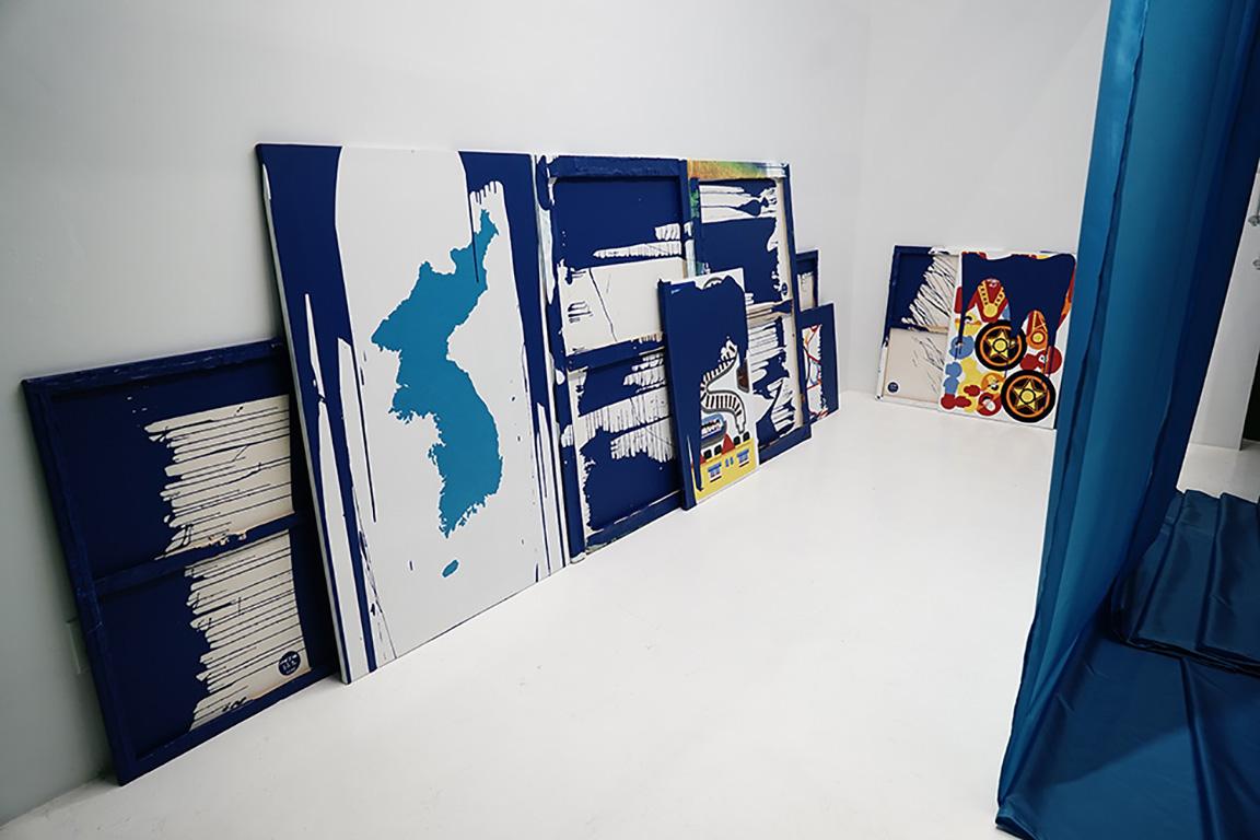 Installation at solo-show “UMMA : MASS GAMES” at the Ethan Cohen Gallery NY in 2017-2018. This is a series of dream paintings stacked like card games in the gallery, symbolizing new ways of playing underground in North Korea, with the center piece being the Korea’s third flag, the Unification flag.