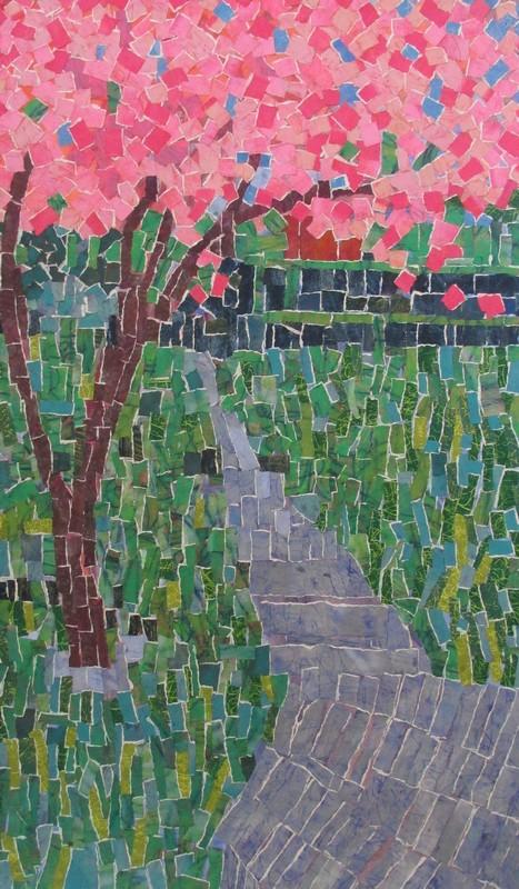 Torn Hand-colored paper to represent a cherry blossom tree on a path