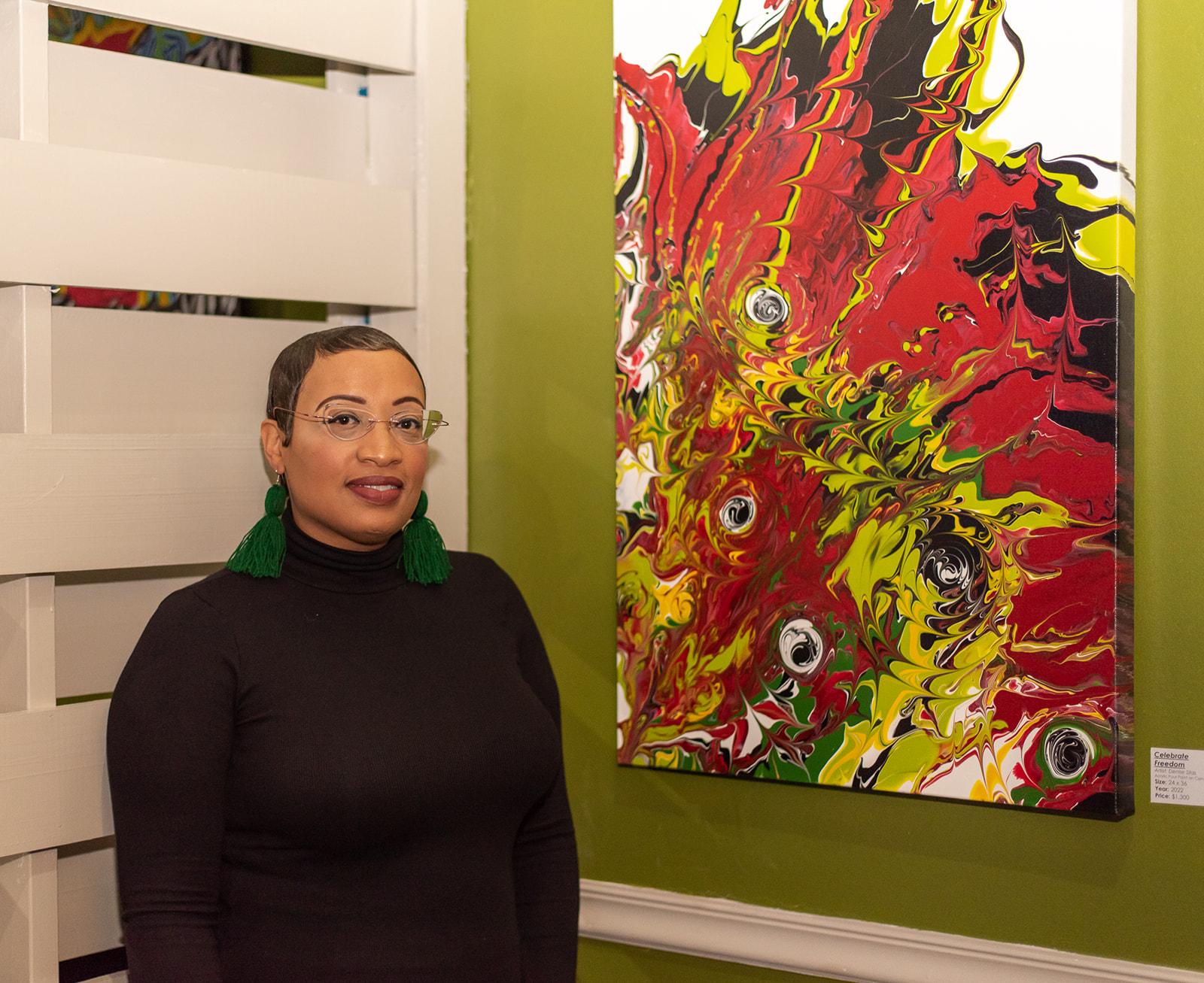 Artist, Denise N. Silas at the Bistro 64 in District Heights, MD to celebrate the restaurants opening night and her first art installation. This fluid art painting was created in celebration of Juneteenth displaying the color palette adopted by black communities of the African Diaspora.
24 x 36 Dutch Pour on Gallery Wrapped Canvas
