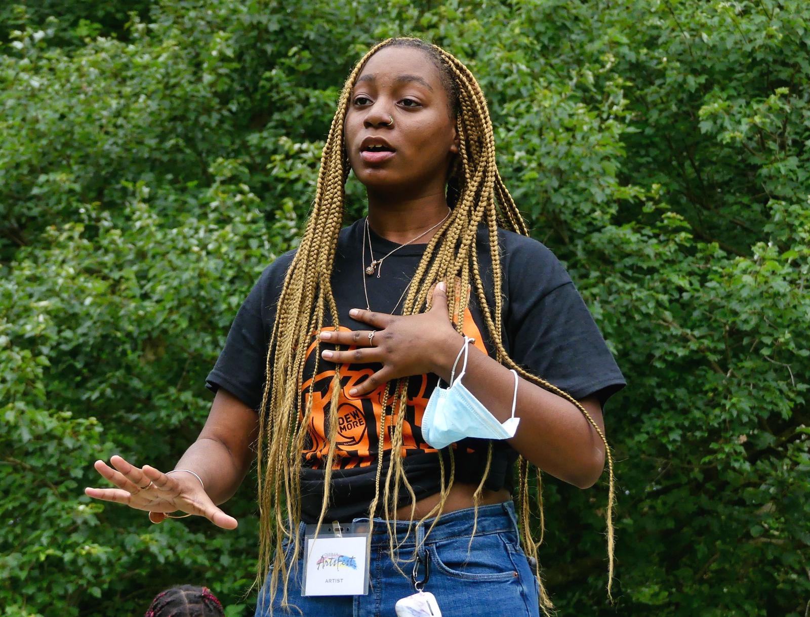 One of the spoken word artists from Dewmore Poetry Baltimore shares her performance with the audience at the Overlea ArtsFest 2021. Photo by Media Service Studio.