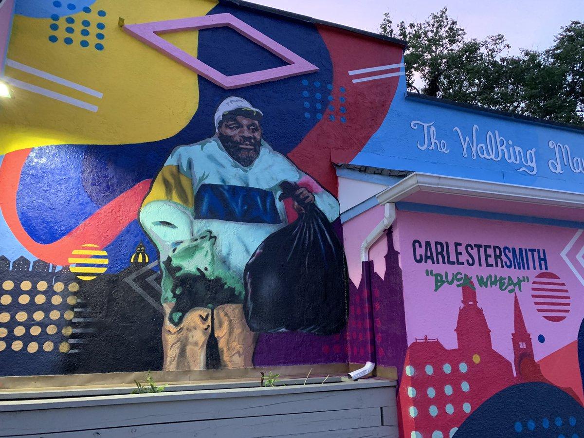 This is a mural dedicated in the memory of Carlester Smith aka The Walking Man which is located on the sidewall of Pinkey's Liquors in Annapolis, Maryland on West St.
