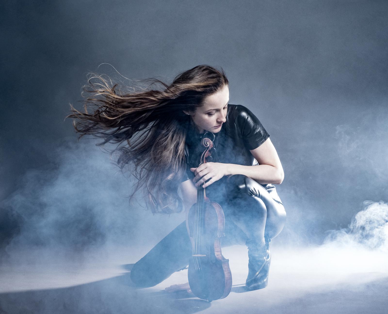 Artist appears as a model holding a violin Idea: applicant Photo: Dario Acosta Photography