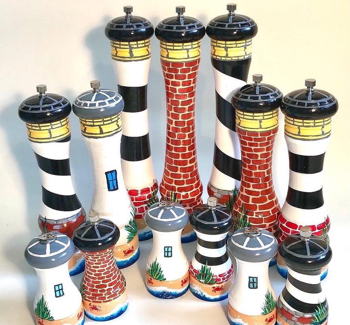 Lighthouse themed pepper mills and salt and pepper sets.
Inspired by the lighthouses of the Outer Banks, North Carolina, I replicated several as tall pepper grinders or smaller salt and pepper sets. 
Unique and special functional art!!
A striking conversation piece. 
Something unlike anything else. 
Fully functional and designed to last a lifetime. 
Set the grinder however coarse or fine you prefer and it holds that grind. 
Painted with multiple layers of the finest Liquitex acrylic paint and sealed with a water-based polyurethane varnish. 

