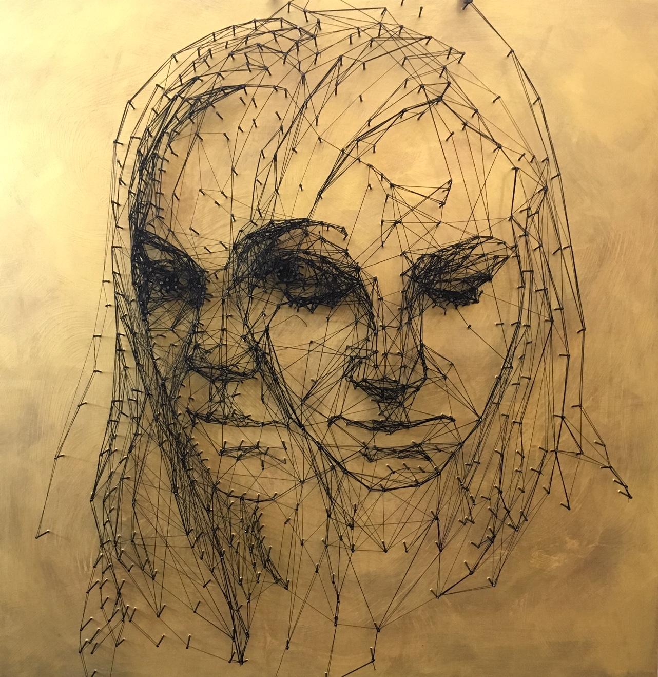 Nail and thread drawing on the wood board