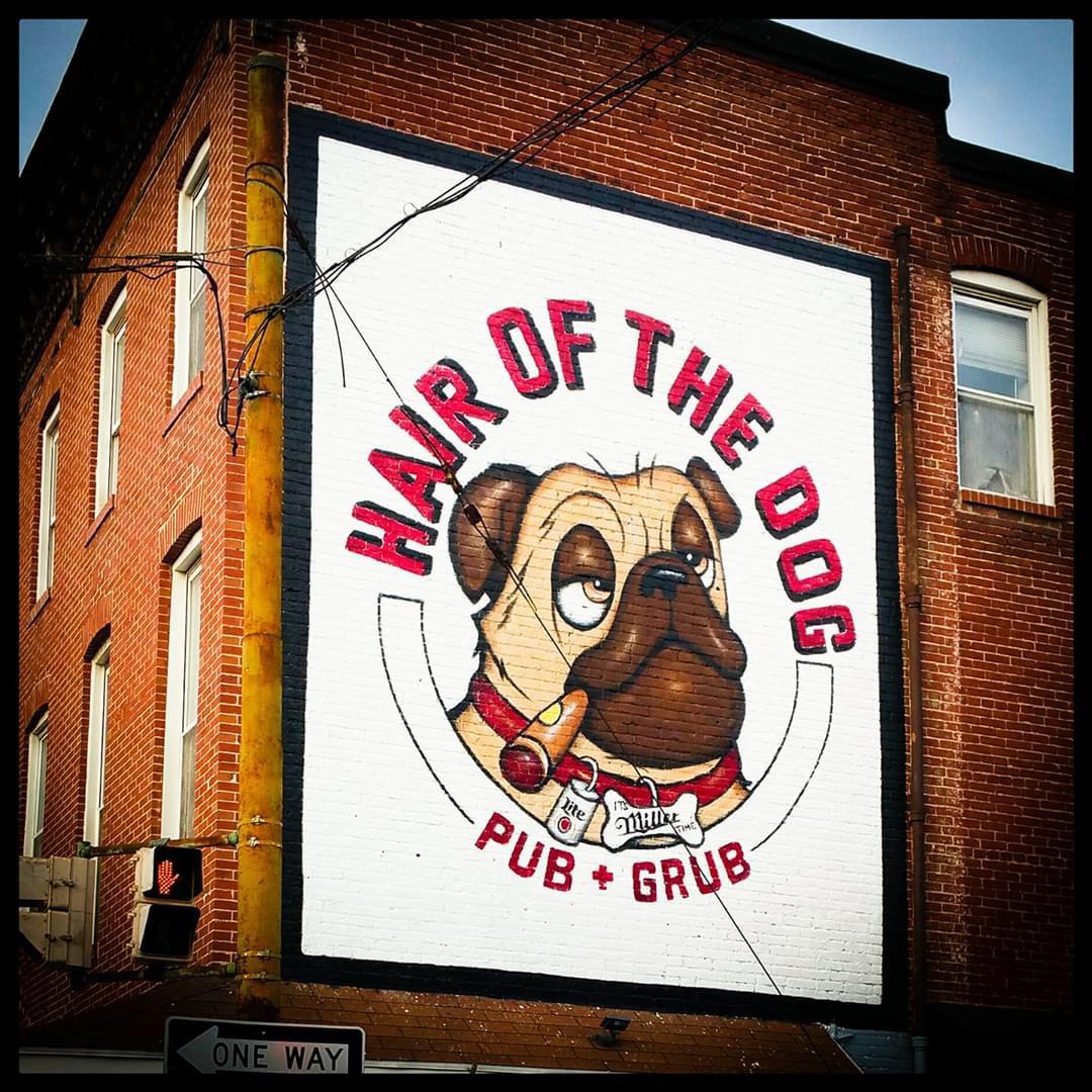I painted a logo of a restaurant in the inner Harbor of Baltimore on the side of the restaurant brick wall exterior.