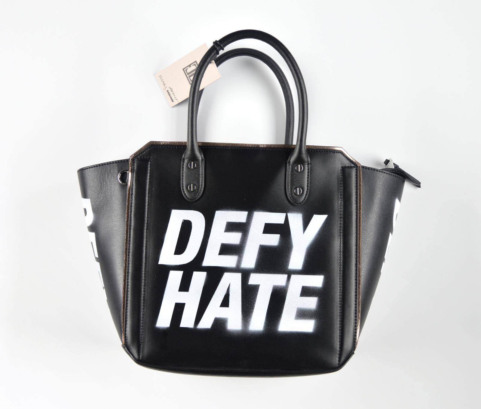 What To Wear To A Protest Satchel – Ivanka Trump Tribeca Solutions Satchel with “DEFY HATE” spray painted in white on the outside, “RESIST” on the outside pocket, “DEFY” on both sides. Shoulder strap, removable zip pouch, and dust bag (not pictured) included. SOLD