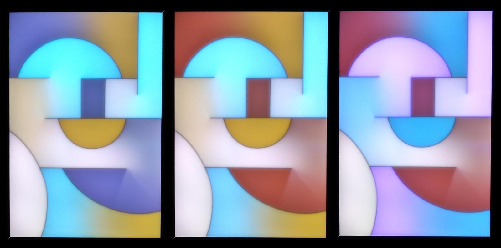 "H'arp" is a light-painting made with RGB LED strips behind a diffusing screen.
The image shows three color-states as the colors slowly change.  Due to the large number of possibilities, color combinations are unlikely to repeat.