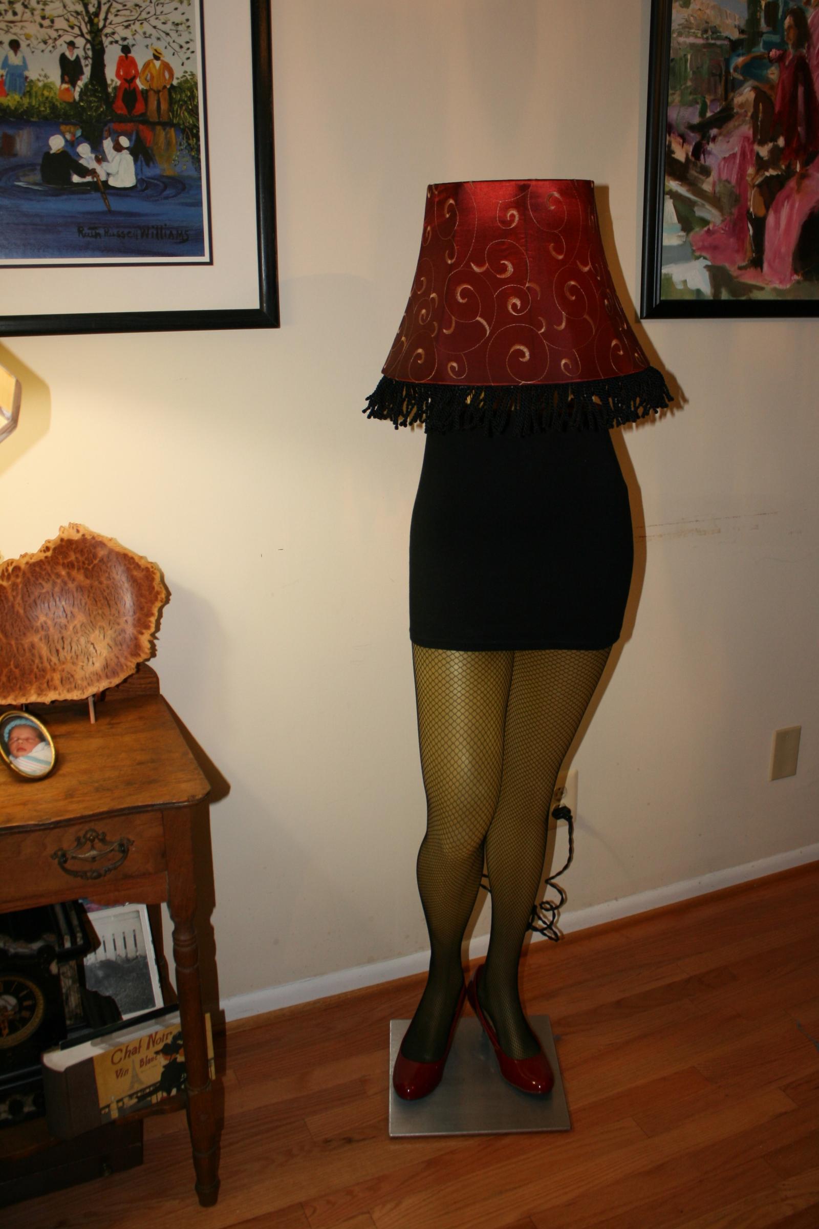 "She's Got Legs" is a pole lamp that is repurposed and upcycled from a mannequin that was formerly used to display women's slacks, pants, jeans, etc. She's wearing a short skirt,  fishnet pantyhose,  heels and a lampshade that did not photograph well. Feel free to request additional info and pics.