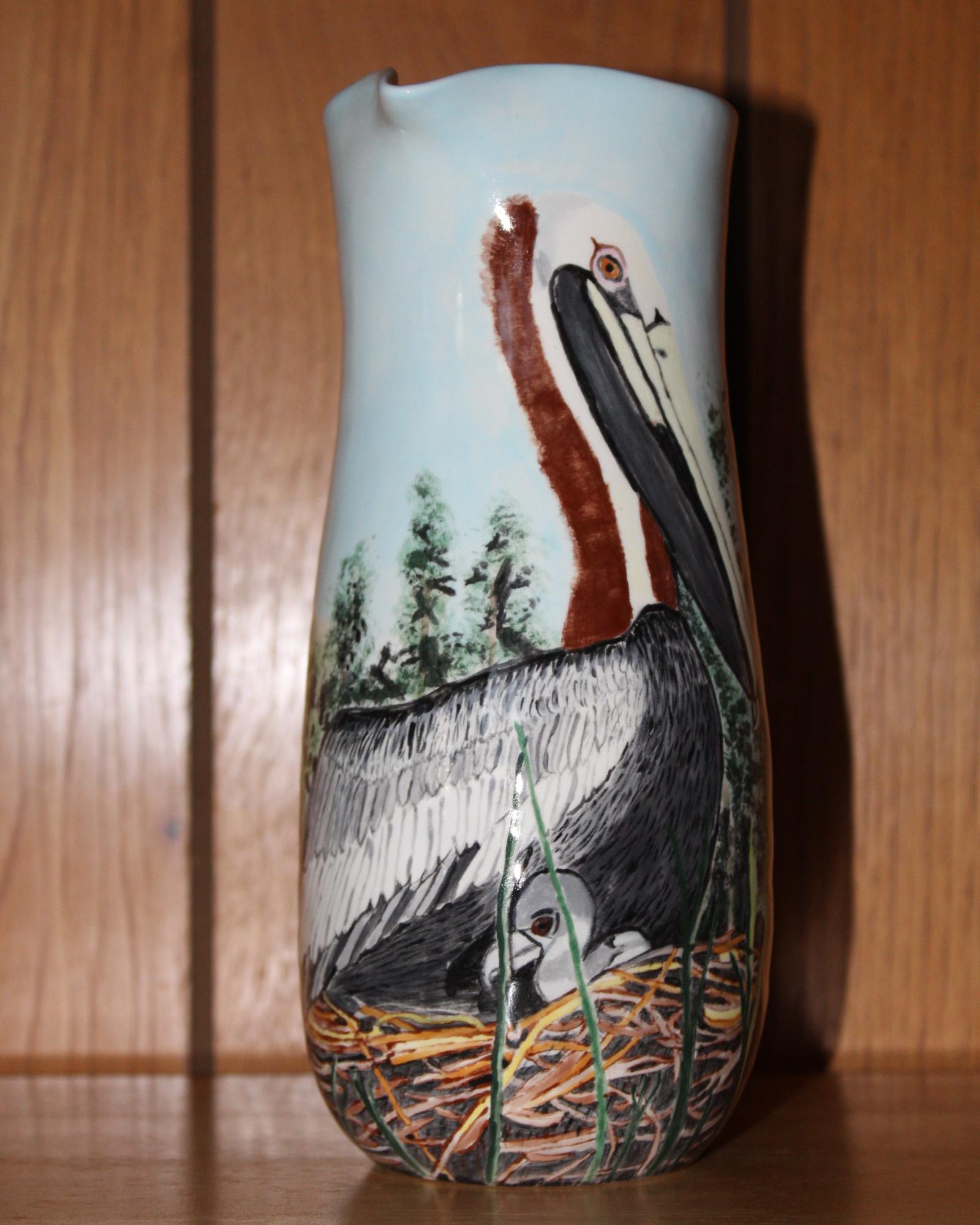 This is hand drawn and painted on a ceramic bisque pitcher.  The picture is inspired from a photograph I took while on a photography workshop with Jay P. Fleming.  It is painted with Stroke and Coat glaze, with a clear glaze over top.  This is low fire food safe, but not dishwasher, freezer or microwave save, hand wash only.  This and two other pitchers are for sale at the Somerset County Arts Council in Crisfield, MD.