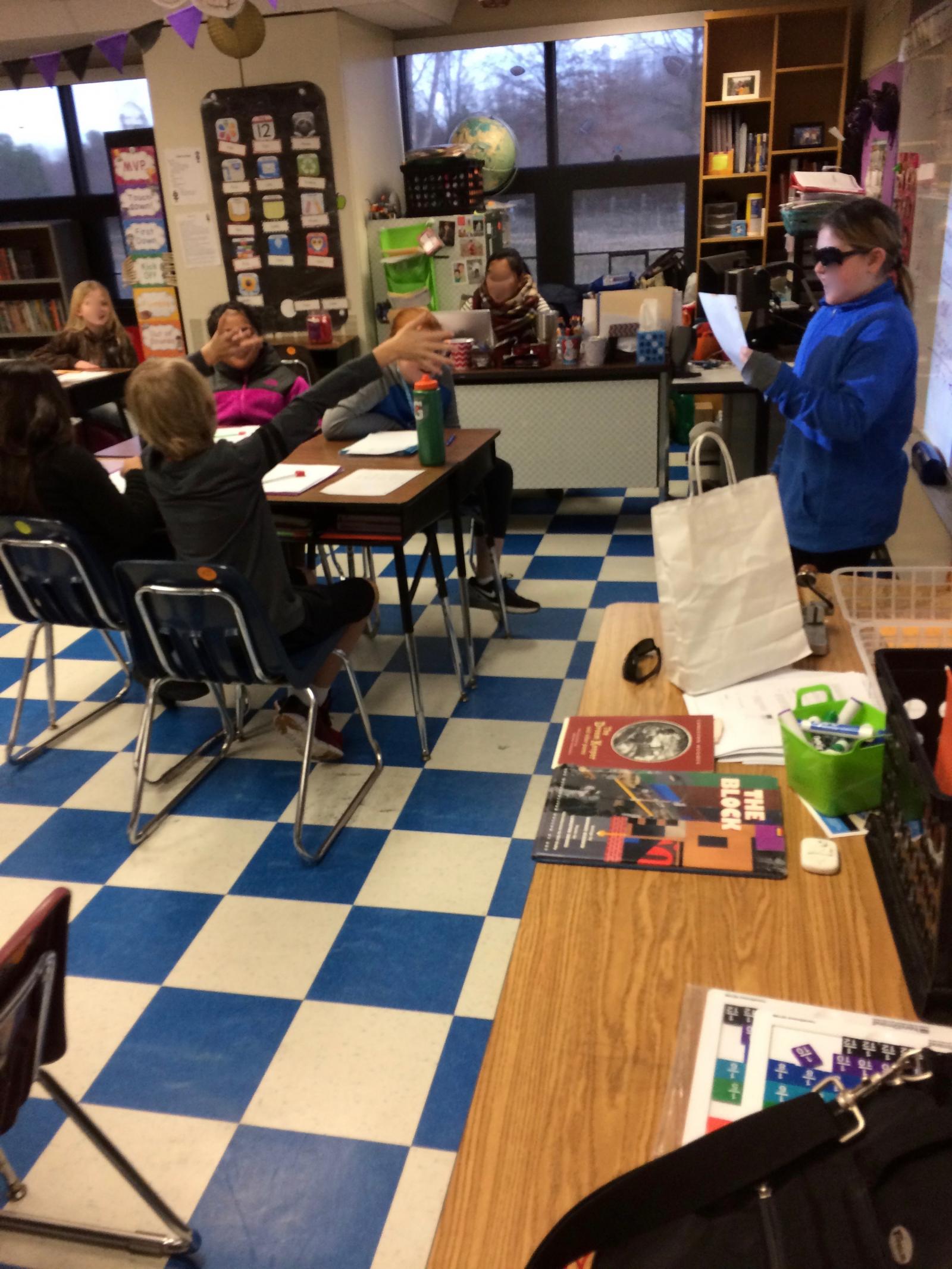 Students shared blues poems inspired by Langston Hughes—complete with music and sunglasses!